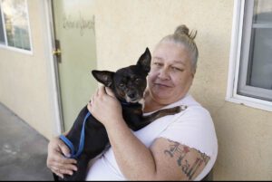 Woman holding her dog
